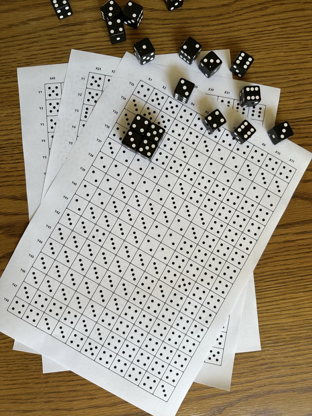 Printed Dice & Dots instruction sheets with X and Y grid coordinates